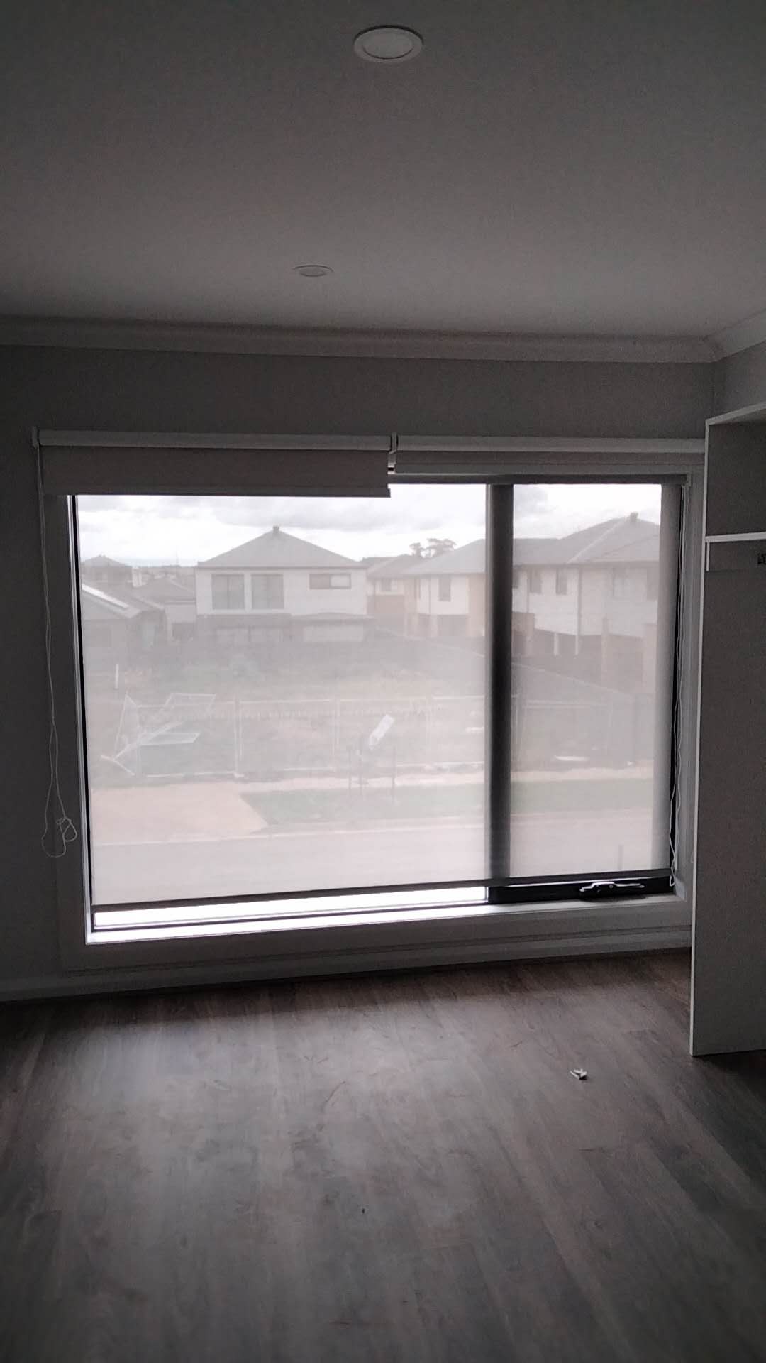 Ellis Services dual roller blind installation on a wide window