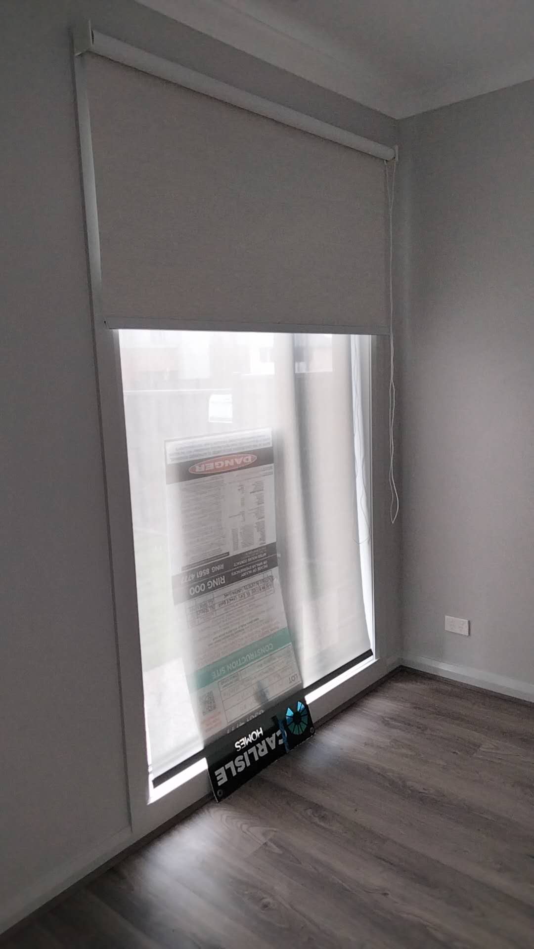Ellis Services roller blind fitted to a tall residential window